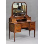 An Edwardian mahogany inverted breakfront dressing table with chequer stringing, fitted with a swing