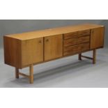 A mid-20th century McIntosh & Co teak sideboard, fitted with drawers and cupboards, on block legs,