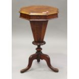 A Victorian walnut octagonal work table, the hinged lid above carved cabriole legs, height 71cm,