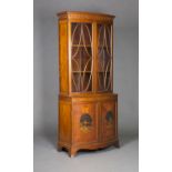 An Edwardian satinwood bowfront bookcase cabinet with overall ebony line inlaid and crossbanded