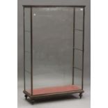 A mid-20th century French steel and glazed shop display cabinet, fitted with glass shelves, on