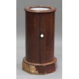 A Victorian mahogany cylinder pot cupboard, the inset marble top above a cupboard, on a plinth base,