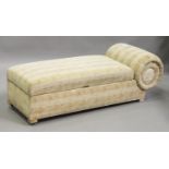 An Art Deco style scroll-end day bed, upholstered in patterned fabric, on block feet, height 52cm,