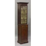 A George III mahogany bookcase cabinet section, the dentil moulded pediment above an astragal glazed