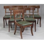 A set of six Regency mahogany bar back dining chairs, the backs with ebony inlaid floral sprays