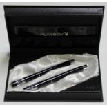 A Playboy fountain pen and rollerball pen set, within a Playboy writing instrument case and box.