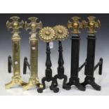 A pair of modern cast iron and brass mounted andirons with sunflower finials, height 48cm,