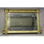 A late 19th century giltwood sectional overmantel mirror, the inverted breakfront pediment above