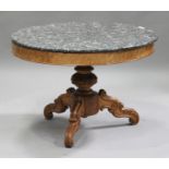 A late 19th/early 20th century French bird's eye maple circular centre table with a grey marble top,