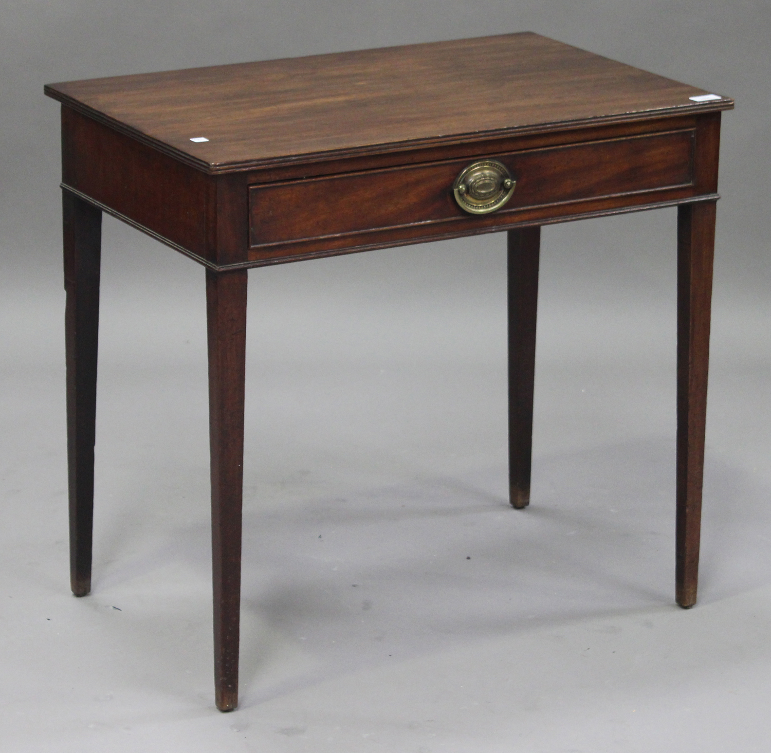 A George III mahogany side table, fitted with a single frieze drawer, raised on square tapering