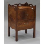 A late George III mahogany night table with boxwood stringing, the gallery top with pierced handles,