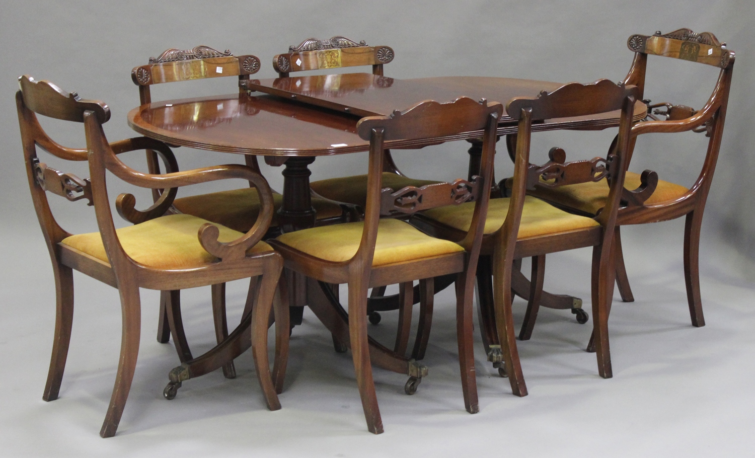 A set of six 20th century Regency style mahogany dining chairs with brass inlay, comprising two