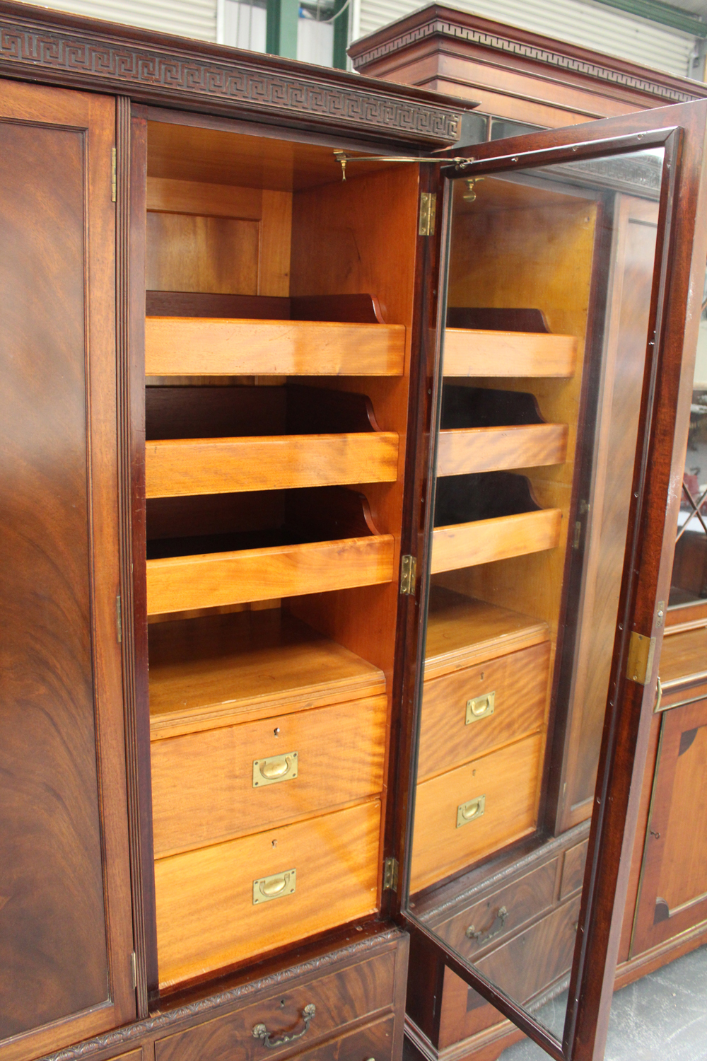 A George V figured mahogany three-section compactum wardrobe, fitted with an arrangement of drawers, - Image 2 of 2