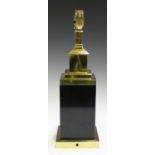 An Art Deco style polished brass and black table lamp of square section, height 38cm.Buyer’s Premium