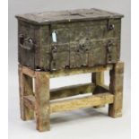 A 17th century Armada type wrought iron chest, the hinged lid and front with overall strapwork,