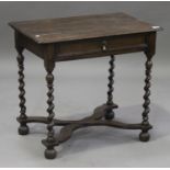 An early 18th century oak side table, the frieze fitted with a drawer, raised on barley twist legs