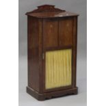 An Edwardian Art Nouveau mahogany music cabinet with foliate inlaid decoration, fitted with a glazed