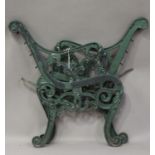 A pair of 20th century cast iron garden bench ends, the foliate scrolling frames with lion mask