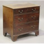 A George III mahogany bachelor's chest of three long drawers, the moulded top above a drawer