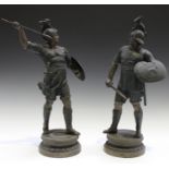 A pair of late 19th century patinated cast spelter figures, each depicting an ancient warrior