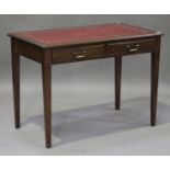An early 20th century mahogany writing table, the gilt-tooled red leather top above two drawers,