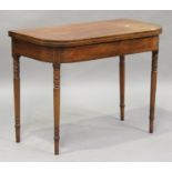 A George IV mahogany fold-over tea table, the frieze with boxwood line inlaid borders, raised on