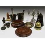 A small group of metalware, including two bronze pestles and mortars, a brown patinated bronze bell,