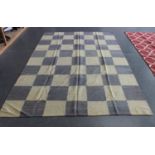 A modern flatweave carpet with an overall chequer design of blue and white squares, 287cm x 197cm.