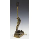 A 20th century cast gilt bronze table lamp in the form of a cobra, raised on a rectangular base,