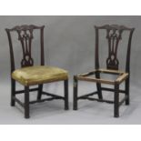 A pair of George III Chippendale period mahogany dining chairs with carved decoration, the pierced