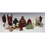 A collection of late 20th century Eastern carved Buddhas and other figures.Buyer’s Premium 29.4% (
