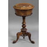 A Victorian burr walnut teapoy, the octagonal hinged top raised on a turned and baluster column