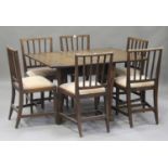 A set of six early 19th century oak rail back dining chairs with drop-in seats, on square tapering