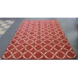 A modern flatweave carpet with an overall design of a red square lattice, 294cm x 201cm.Buyer’s
