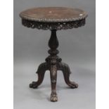 A late 19th/early 20th century Burmese carved padouk circular occasional table, the carved top