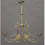 An Art Nouveau brass two branch ceiling light, formerly fitted for gas, the central stem