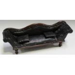 A Victorian mahogany framed diminutive model of a scroll back settee, upholstered in black