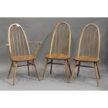 A set of three Ercol elm and beech dining chairs, comprising one carver and two standard chairs,