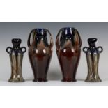 A pair of Continental art pottery vases, late 19th/early 20th century, the swollen bodies applied