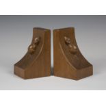 A pair of Robert 'Mouseman' Thompson oak bookends, each curved end with typical carved mouse