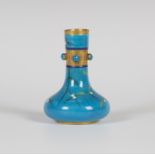 A Minton pottery turquoise glazed small bottle vase, circa 1890, designed by Christopher Dresser,