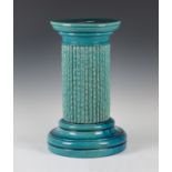 A Burmantofts pottery turquoise glazed jardinière stand, late 19th/early 20th century, of column