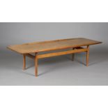 A mid-20th century Danish teak coffee table, designed by Grete Jalk for Poul Jeppesen, the shaped