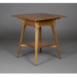 An Edwardian Arts and Crafts oak two-tier square occasional table, in the manner of Liberty & Co,