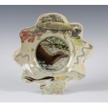 A Maureen Minchin studio pottery bowl, the interior decorated with an otter, the wavy edged rim with