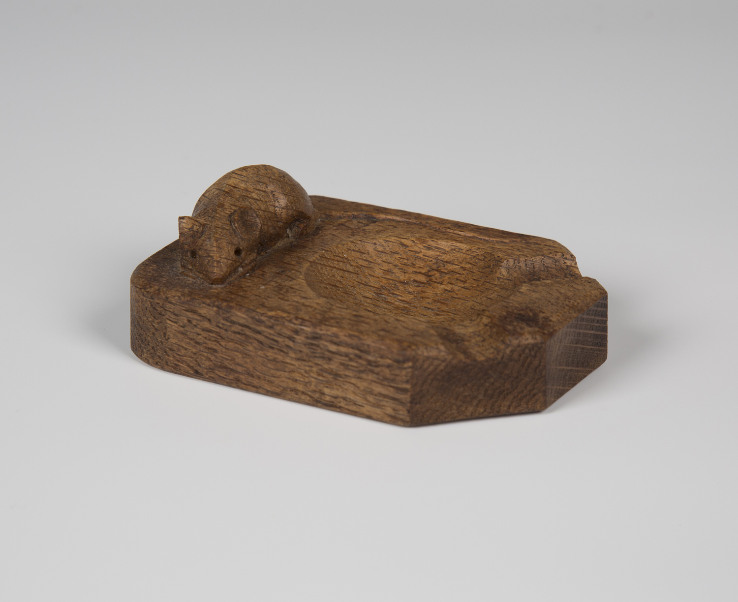 A Robert 'Mouseman' Thompson oak ashtray, the top carved with typical mouse signature, length 10.