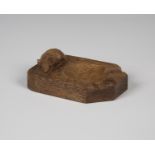 A Robert 'Mouseman' Thompson oak ashtray, the top carved with typical mouse signature, length 10.