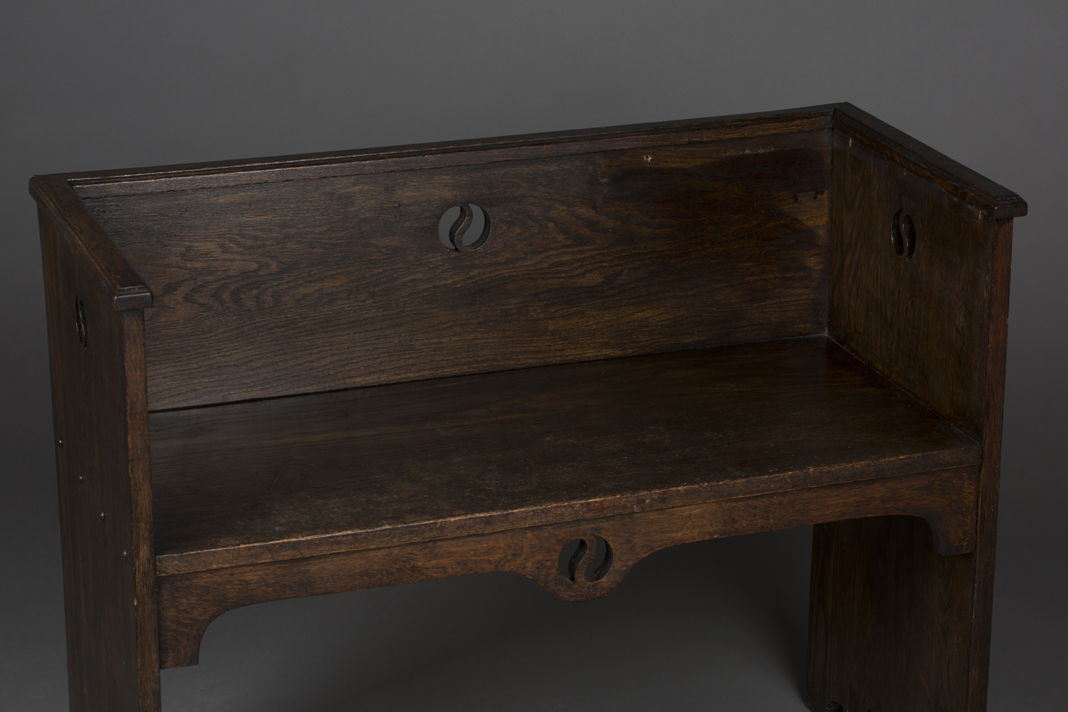 An early 20th century Arts and Crafts style stained oak hall bench, possibly by Liberty & Co, the - Image 4 of 4