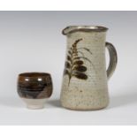 A Jeremy Leach Lowerdown Pottery tenmoku glazed yunomi, impressed seal marks to base, height 8.