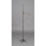 A 20th century wrought iron adjustable floor-standing lamp, in the manner of W.A.S. Benson, the